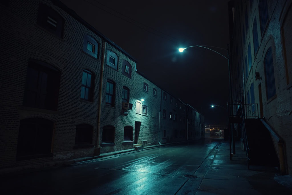 Dark urban city alley at night.