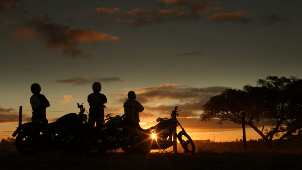 Motorcyclists enjoying the sky in late afternoon.